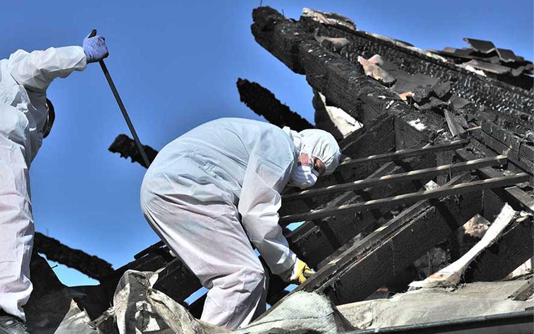 Restoration experts cleaning up after fire damage